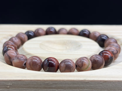 Bracelet Bois fossile rouge et Oeil de taureau